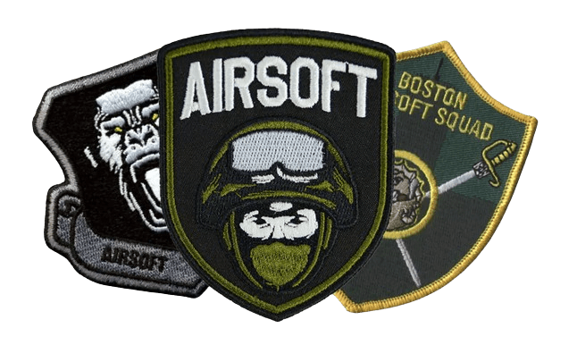 three patches that airsoft pratictioners put on their camo vests, the first with a gorilla, the second with a soldier and the third with swords